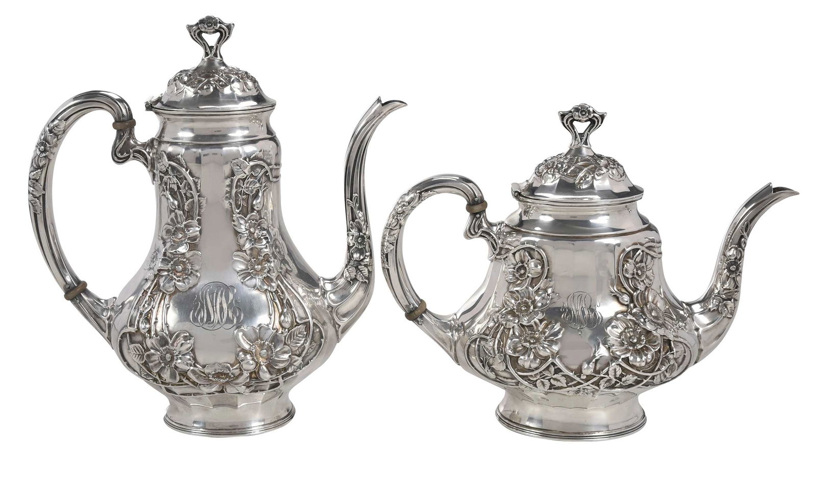 Two Wallace Sterling Coffee and Teapot: American, 20th century, paneled urn form with vine and floral decoration, scroll handle, ivory spacers, monogram, marks for Wallace Silversmiths, 34.09 oz. T., 10 in. coffee pot with matching teapot P