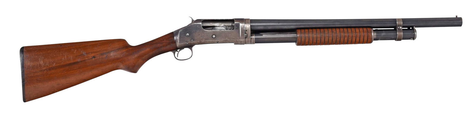 Winchester 1897 Takedown Riot Shotgun: cal. 12 gauge, SN 730943 in two places under receiver, 19 in. barrel with brass bead front sight, "Model 1897 WINCHESTER..." stamped on slide, other manufacturer stamps on barrel, "FULL" bore marking,