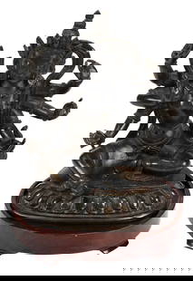 Sino-Tibetan Bronze Seated Ekajati Figure: Qing dynasty, dated Qianlong period by Crane Gallery Inc., #30 on 2012 appraisal, Qianlong reign mark to base, patinated bronze figure depicting Ekajati/Blue Tara seated in lalitasana on lotus base, s