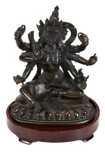 Sino-Tibetan Bronze Seated Ekajati Figure: Qing dynasty, dated Qianlong period by Crane Gallery Inc., #30 on 2012 appraisal, Qianlong reign mark to base, patinated bronze figure depicting Ekajati/Blue Tara seated in lalitasana on lotus base,