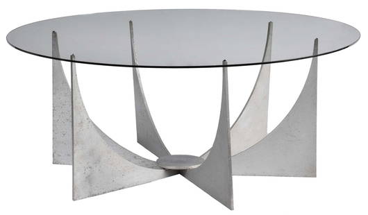 Mid Century Modern Cast Aluminum and Glass Coffee Table: possibly Donald Drumm or after, later round glass top, modernist bracketed base, 15-1/2 x 38-1/2 in. Provenance: Private Collection