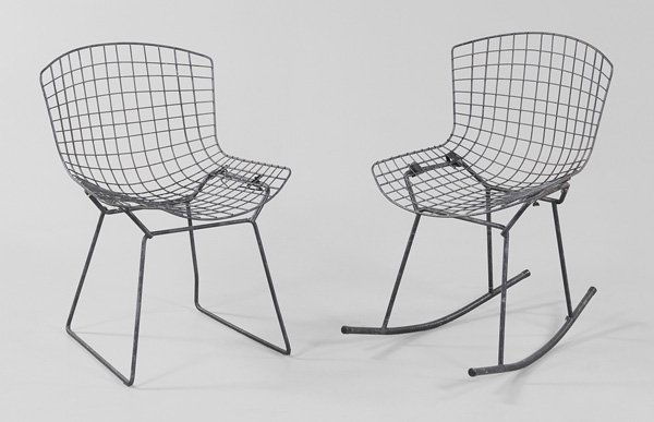 Two Bertoia Wire Chairs: designed by Harry Bertoia, probably manufactured by Knoll, 20th century, 31 x 21 x 21 in. and 29-1/2 x 21 x 21 in., extensive surface corrosion, seats loose and with later attachments Provenance: Prop