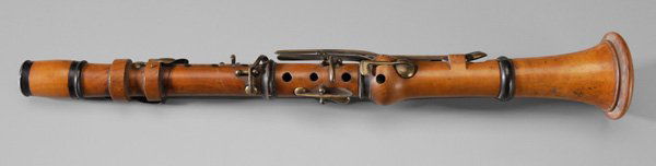 Boxwood E Flat Clarinet: British or French, 19th century, turned boxwood with ebony(?) mounts and brass fittings, 16-3/4 in., some warping, otherwise generally good condition with surface wear, some cracks to fittings, marked