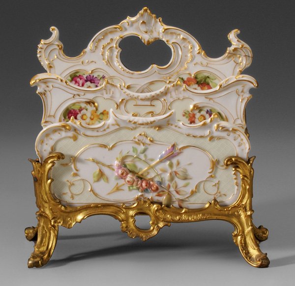 Continental Gilt Bronze and Porcelain: Letter Stand German, late 19th century, Louis XV style frame set with three porcelain panels, marks in blue (possibly KPM), retailer's label "Gilman Collamore & Co. 5th Ave. & 30th St. New York", 9-3/
