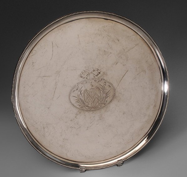 George III English Silver Tray: London, 1785, round with beaded border, marks for Daniel Smith & Robert Sharp, heraldic device, .925 fine, 60.74 oz.T., 16 in., good condition, light scratches, later feet Provenance: Mrs. B.B. Howard