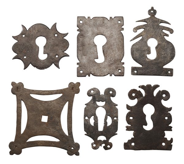Sixteen Iron Escutcheons: probably Continental, 19th century or earlier: cartouche, geometric, diamonds, squares, rectangles, one heart form, 2-1/2 in. to 6-1/4 in., scattered light rust, some elements bent and/or creased Prov