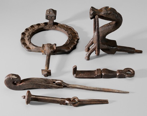 Five Pieces Hand Forged Door Hardware: door knocker with multiple geometric borders, 11-1/4 in.; door pull shaped as horse with horseshoe, 7-1/4 in.; three door knockers, two with spikes, longest with crosshatch decoration, 7-1/2 in. to 14