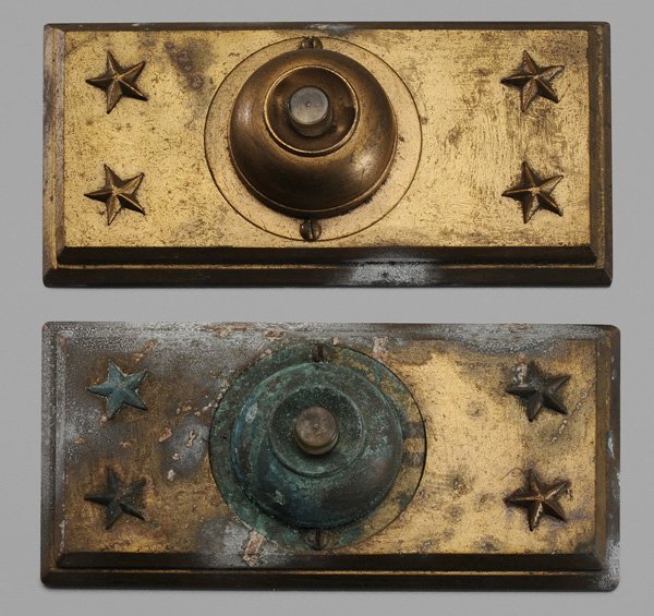 Pair Heavy Bronze Bell Ringers: late 19th/early 20th century, each rectangular plate with raised star decoration and central push button with holes behind for wiring, each 6-1/2 x 3-1/4 in., scattered surface corrosion Provenance: M