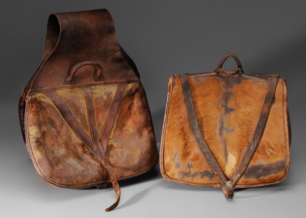 Two Pairs Leather Saddlebags: V-shaped strapping, each about 42 in., some seam separations, some elements stiff Provenance: Property from a Jonesborough, Tennessee, Historic Home