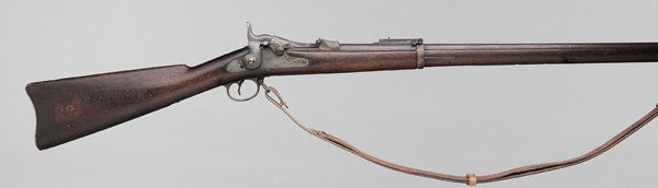 Springfield Trapdoor 45-70 Rifle: 32-1/2 in. round barrel with visible marks, serial number 558816, ramrod bayonet, trapdoor marked "US/Model/1884", stock with inspector's cartouche dated 1892, butt plate marked "US/B/5/19", lockplate
