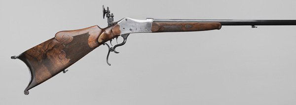 Scheutzen German Target Rifle: late 19th century, 27-1/2 in. barrel marked "Carl Stiegelb, München" and "Prima Kruppscher", serial number 10272, .32 cal., highly figured walnut stock with checkering and scrolled carving, pronounce