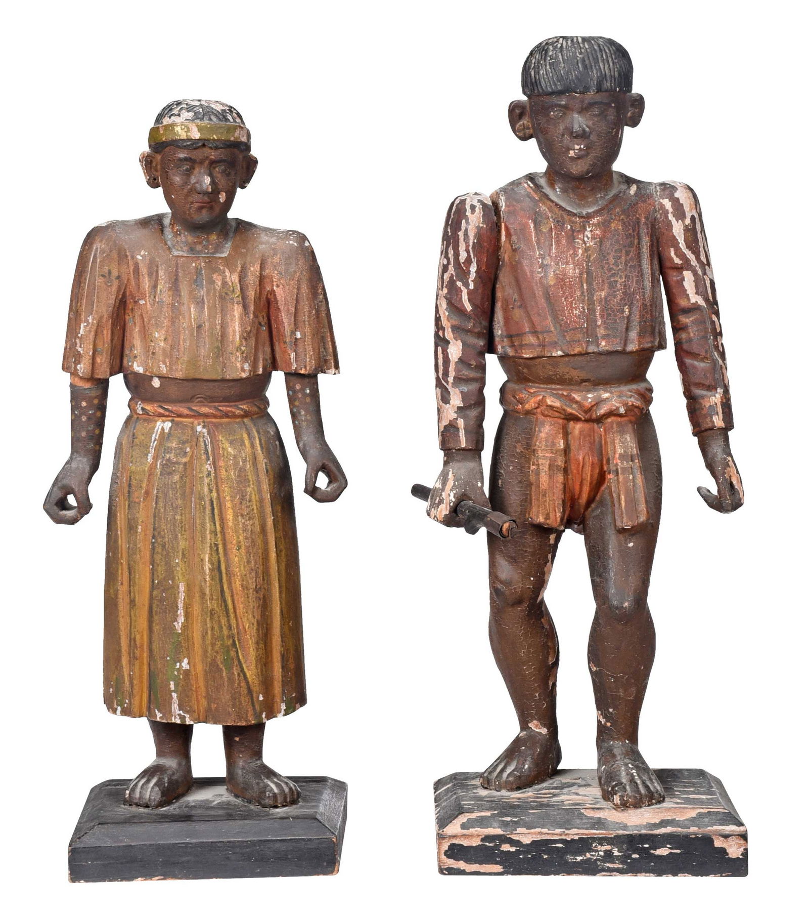 Two Carved and Polychrome Wood Figures: Continental, possibly 19th century, two figures in Mayan dress, larger 21-5/8 x 8 x 6 in. Provenance: Collection of Ben Schecter and George Barimo, Athens, New York