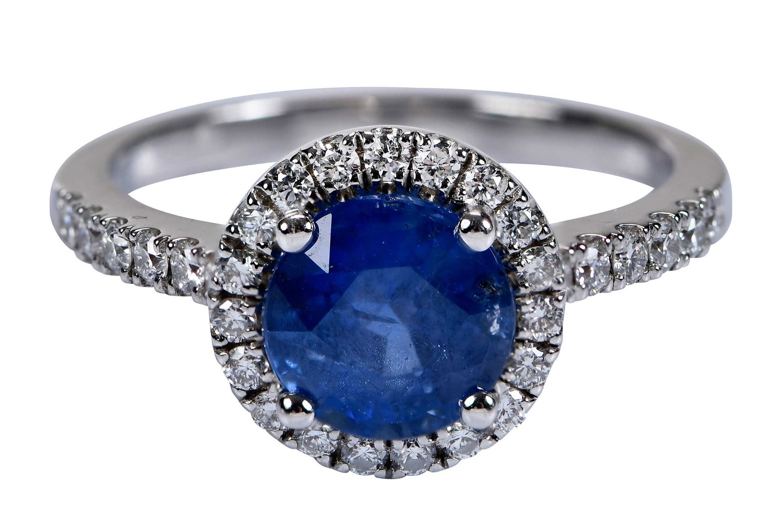 18kt. Natural Burma Blue Sapphire and Diamond Ring - AGL: one round brilliant cut blue sapphire, approx. 1.95ct., AGL report, natural no heat, from Burma, with a halo of round brilliant cut diamonds and accent diamonds along each side of shank, approx. 0.35c