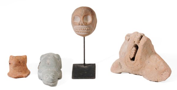Four Pre-Columbian Artifacts: Mexico and Central America: pottery jaguar head, Vera Cruz, 300-900 A.D.; ceramic skull; effigy animal head with traces of black pigment (back with sticker "Hohokam"); carved stone (serpentine?) lizar