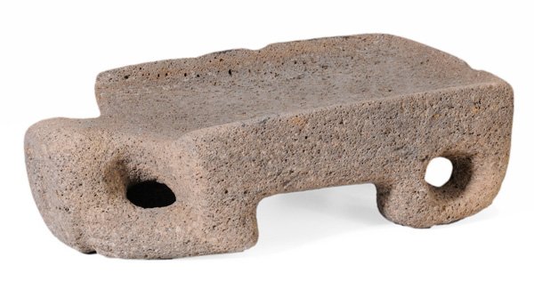 Carved Stone Metate With Human Face: Jalisco or Colima, Mexico, 4-1/4 x 15-1/2 x 9 in., scattered edge chips and wear as found Provenance: Michael Robins, Santa Fe, New Mexico, 1992; Estate of the Late Nancy Webb, Tryon, North Carolina