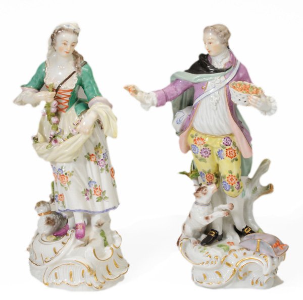 Pair Meissen Porcelain Figures: German, 20th century, gentleman collecting with basket of fruit and lady with apron of flowers, crossed swords marks,11 in., excellent condition Provenance: Private Collection, Waverly, Tennessee