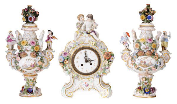 Continental Figural Porcelain Three-: Piece Garniture late 20th century, comprising a pair of flower-encrusted lidded urns set with figures, hand-painted decoration, crossed swords mark, 15-1/2, [one figure lacking hand, figures probably