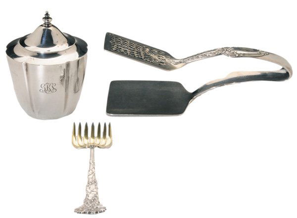 Three Pieces Tiffany Sterling Silver: American, 20th century: Holly and Mistletoe [hors d'oeuvre] fork, gilt bowl, no monogram, 5 in.; Broom-Corn sandwich tongs, monogram, 7-1/4 in.; tea caddy with tapered side, "18182…6522", monogram,