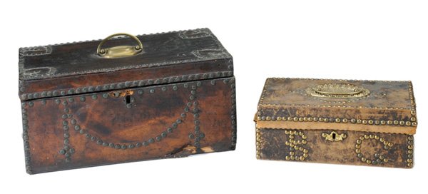 Two Early Leather-Covered Boxes With: Brass Tack Decoration 19th century: one with blue-lined paper interior and partial label for Abraham W. Phillips, Fishkill, New York, 6-1/2 x 14 x 8 in., [hinge broken, wear and tearing to leather at 