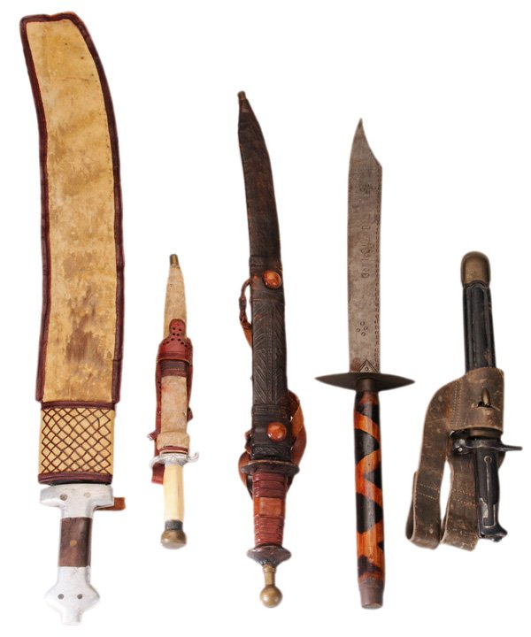 Five Edged Weapons: African, Vietnamese and other world cultures, 20th century: four with hide or leather sheath, 15-1/2 to 32-1/2 in. generally good condition with scattered surface wear and flaws, some minor corrosion 