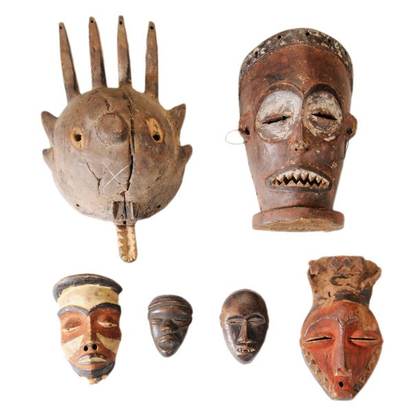 Six Carved Wooden Tribal Masks: African, 20th century: Bamana, Pende and Chokwe cultures, three with traces of polychroming, two mini masks (one set with metal teeth), 4 in. to 14 in., largest with loss at mouth and large shrinkage 