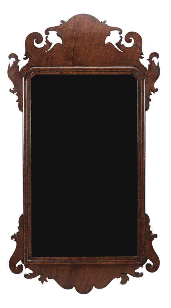 Chippendale Mahogany Looking Glass: British or American, late 18th century, elaborate scrolled ornament and old distressed mirror plate, 37-1/2 in. x 19-1/4 in., scattered veneer cracks and repairs, restorations at crest, scrolls and ea