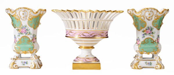 Twelve Pieces Continental Porcelain: German and French, 20th century: including a KPM hand-painted pierced compote, Vienna style covered bowl, pair Sévres style green-and-white ground vases, pair pink-ground Limoges vases, Carlsbad hand