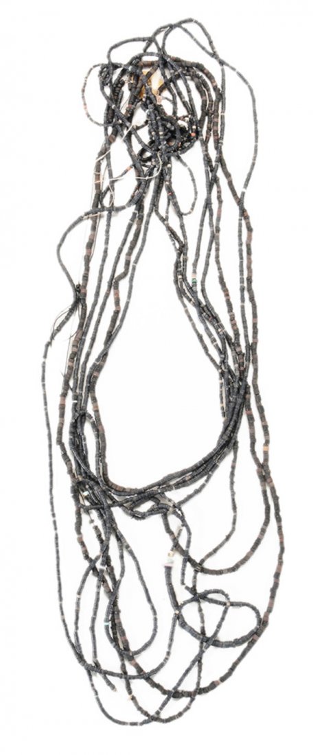 Fine Native American Shell Beaded: Necklace New Mexico, probably prehistoric, exceptionally long and strung with finely crafted black beads interspersed with various other colors, 22 ft., needs restringing (with bag of unconnected bead