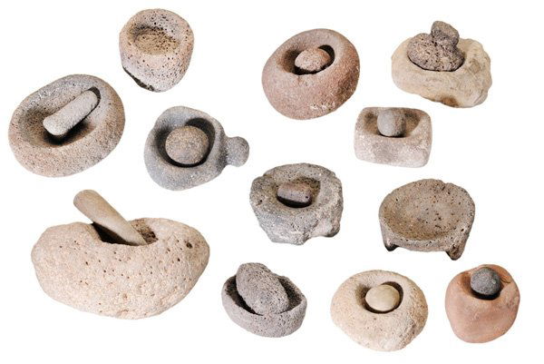 Collection of Twenty Prehistoric: Mortars and Pestles probably Anasazi, Hohokam and other cultures: 12 mortars including one footed and one handled, with eight pestles, in various stones, 3 in. to 9 in., surface dirt, wear and losses