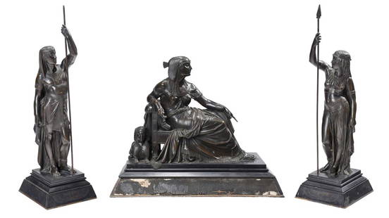 Egyptian Revival Bronze Figural Garniture: probably French, late 19th/early 20th century, comprising: reclining Cleopatra with sphinx, atop tiered trapezoidal plinth, 18-1/2 x 22 x 10 in.; pair of attendants holding spears, one female and one