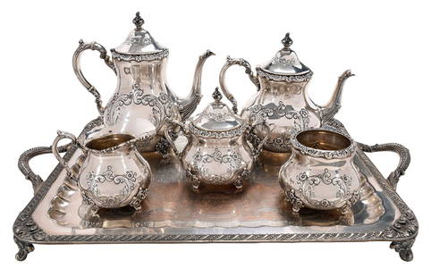 Five Piece Poole Old English Sterling Tea Service and Silver Plate Tray: American, 20th century, pear forms with scroll and floral decoration, ivory inserts, no monograms, all with marks for Poly, "700", 97.83 oz. T., 9-1/2 in. coffee pot with matching teapot, covered suga