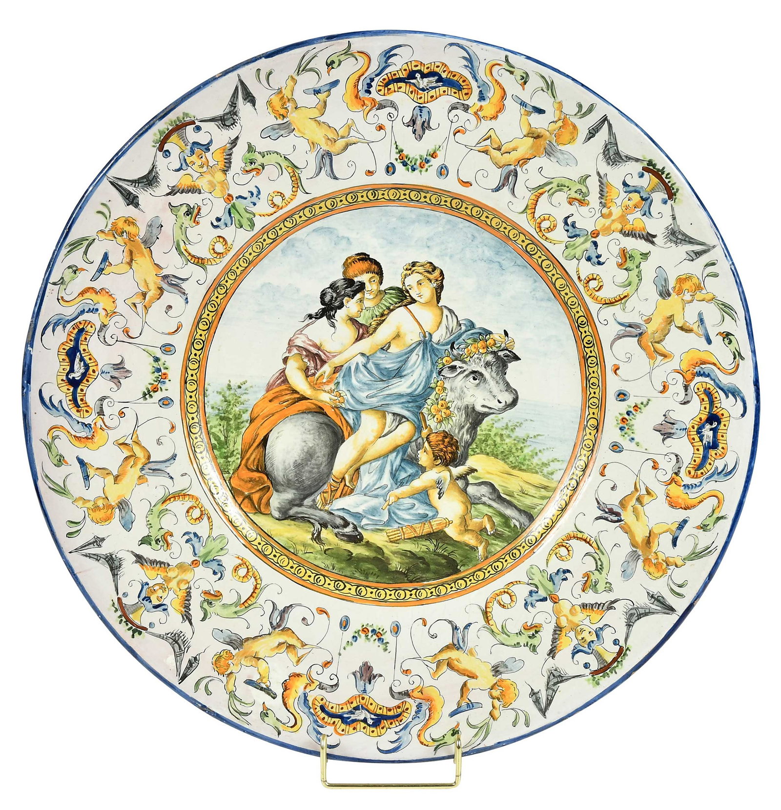 Italian Majolica Renaissance Style Charger, Rape of Europa: late 19th/early 20th century, possibly Giovanni Mollica or Mollica family, marked on the base with a crown over 'M', the center depicting the Rape of Europa, surrounded by figural putti and creature m