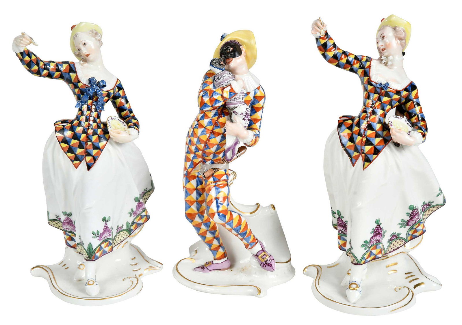 Three Nymphenburg Commedia dell'Arte Porcelain Figures: German, 20th century, impressed Nymphenburg shield mark to bases, comprising: Harlequin, 7/1/2 x 4-1/8 x 3-3/4 in.; two Harlequina figures, larger 8 x 4 x 4-1/4 in. Provenance: Collection of Steve Ste