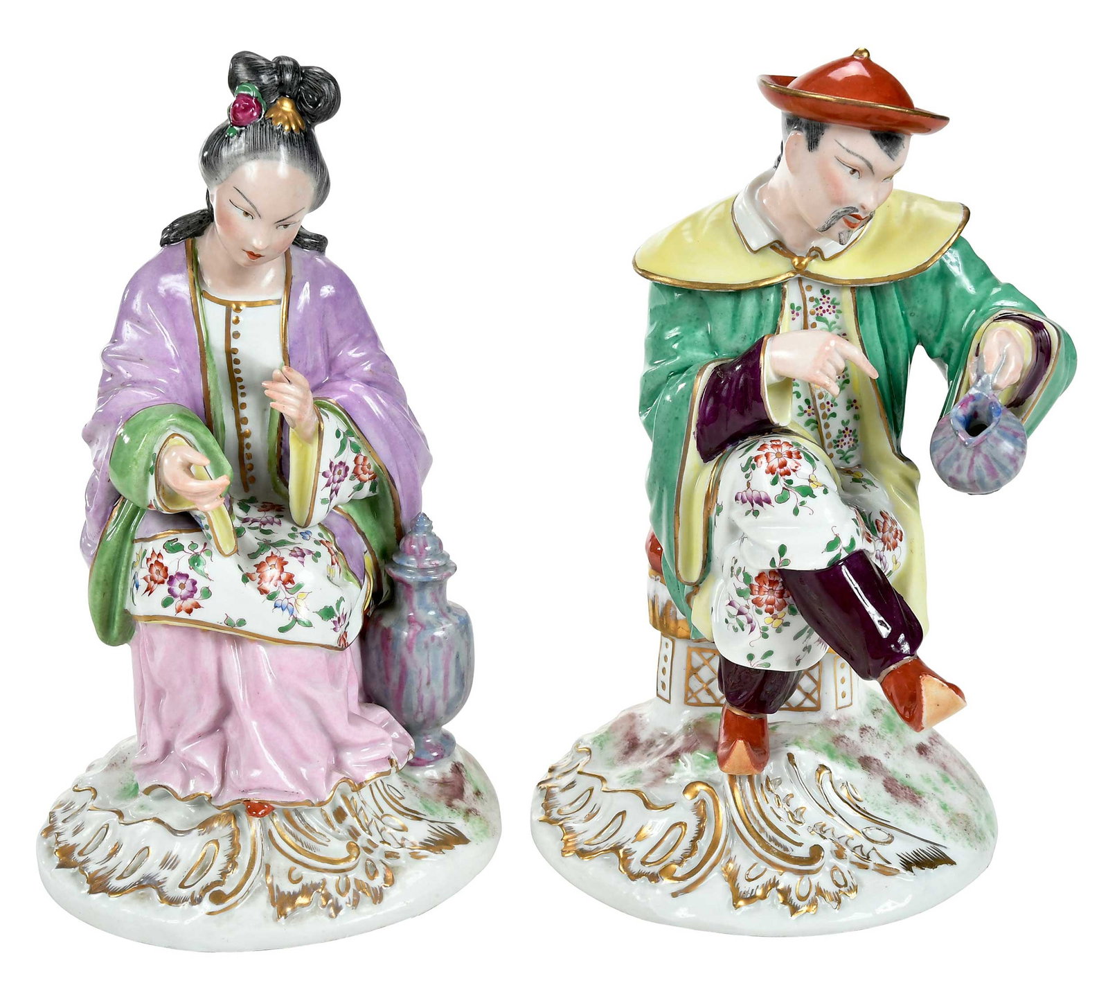 Pair of Paris Porcelain Chinoiserie Figures: French, late 19th/early 20th century, each with crossed arrow marks on ground, seated male and female figures in Chinese dress, larger 10-1/8 x 6 x 6-3/4 in. Provenance: Collection of Steve Stewart, L