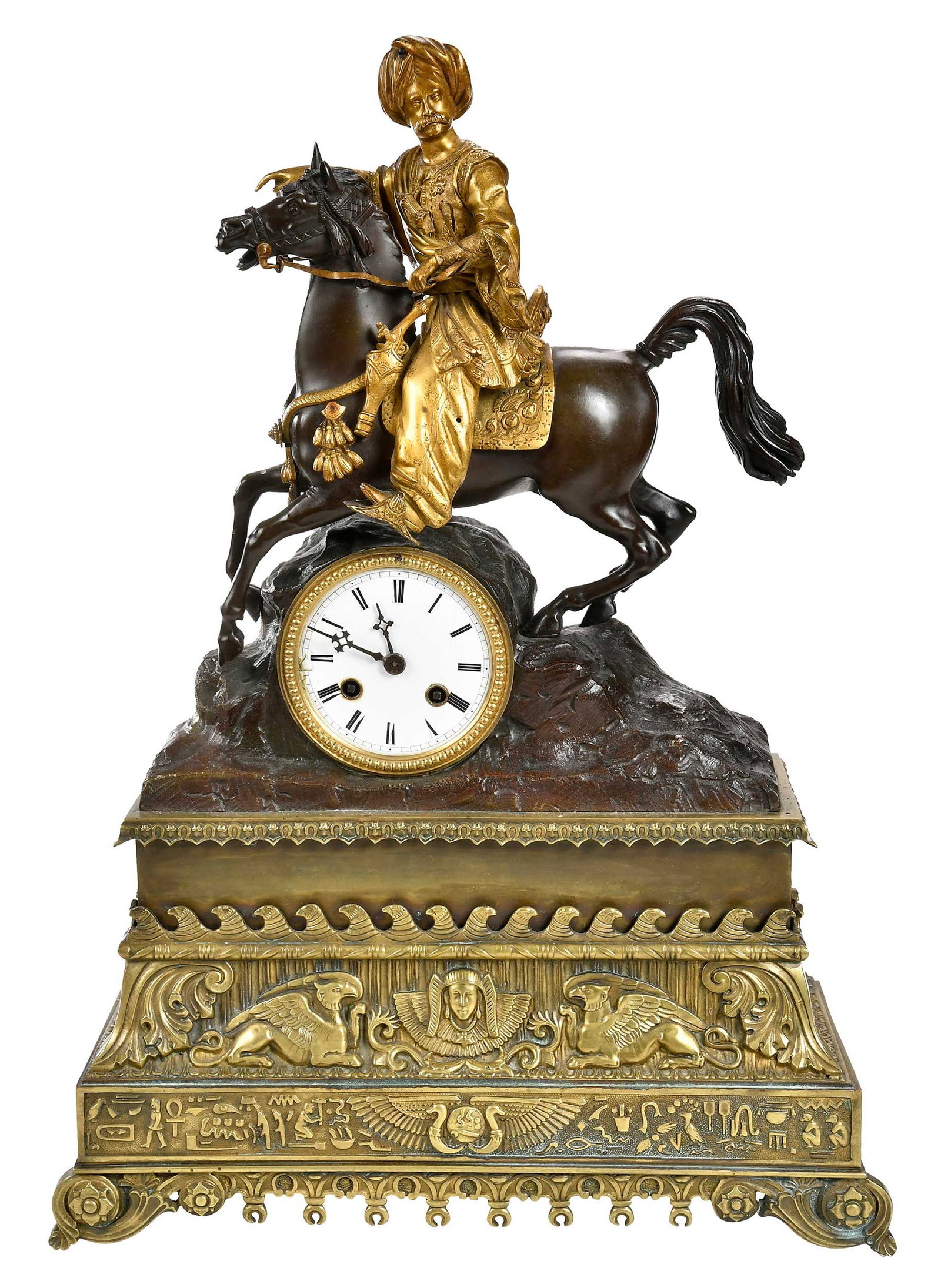 Gilt Bronze Figural Mantel Clock: 19th century, enameled metal dial with Roman numerals set in naturalistic rock form case surmounted by Moorish figure on horseback, atop tiered base with scrolled feet and Egyptian motifs, 20 x 14-1/4