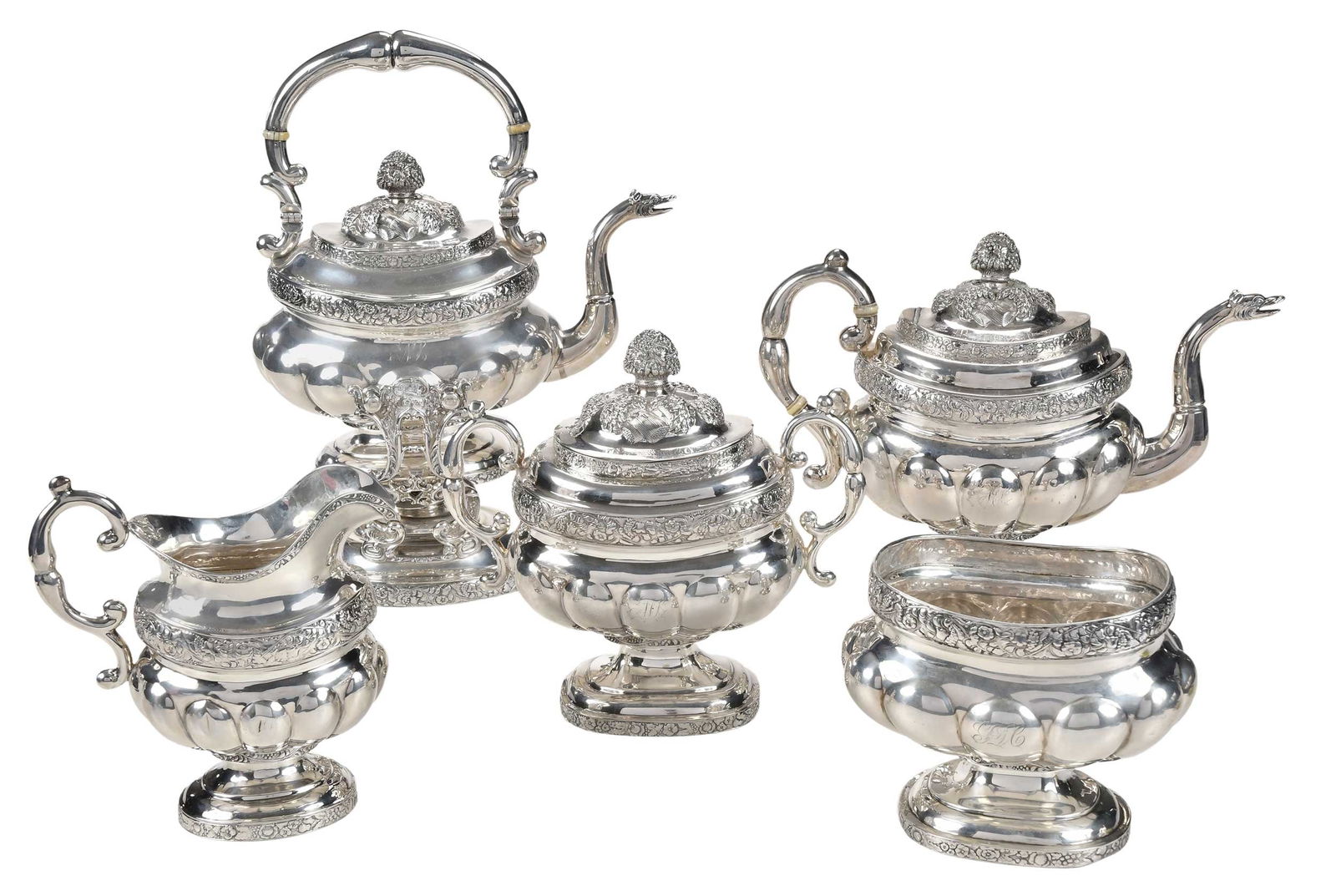 Five Piece New York Coin Silver Tea Service, John Crawford: American, early 19th century, oval lobed body, sheaf of wheat decoration on lid and finial, floral and grape die rolled bands, dragon spouts, ivory spacers, monogram each side, marks for John Crawford