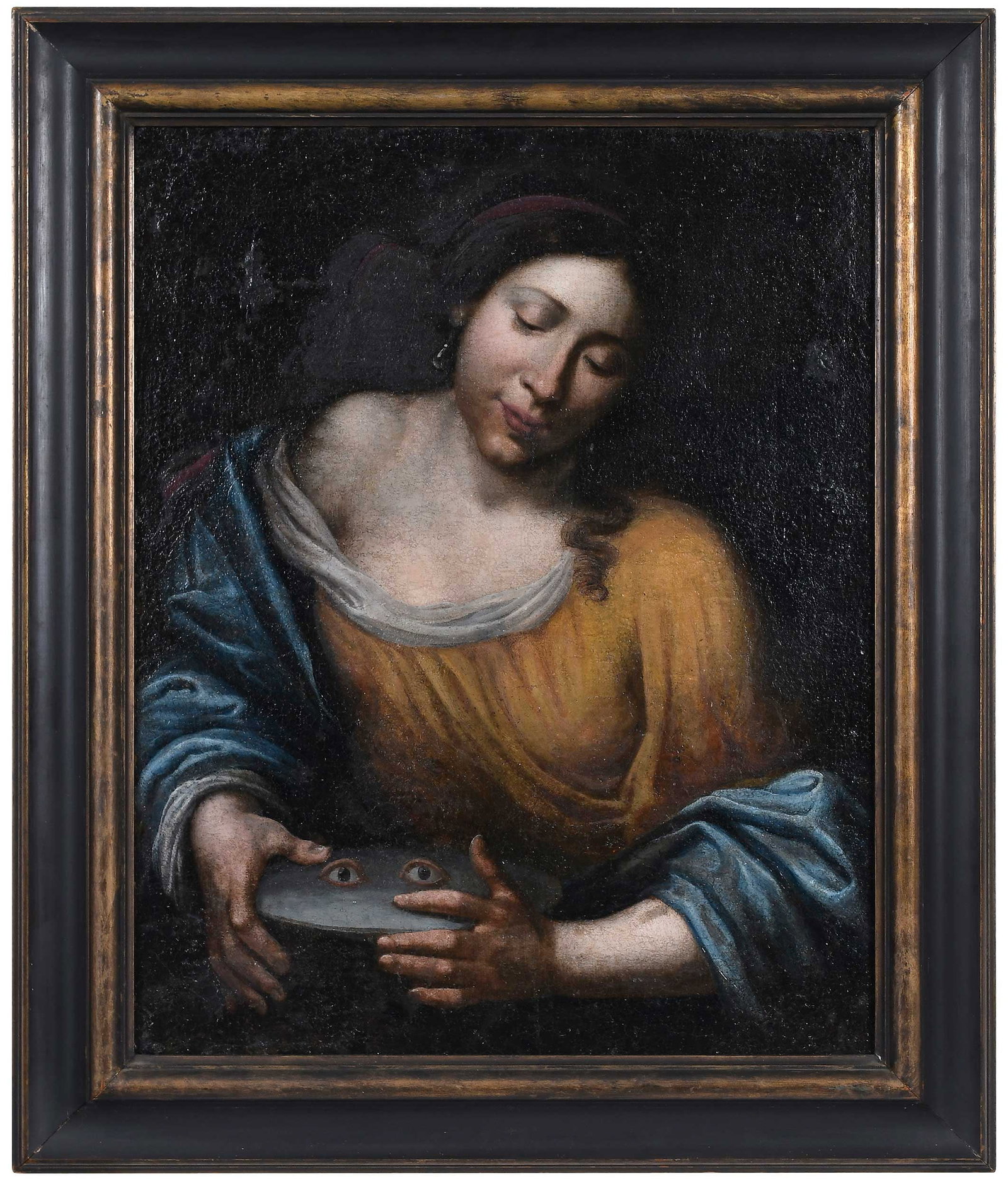 Italian School Painting, Santa Lucia: (17th century) St. Lucy, Her Eyes on a Plate, oil on canvas, 27-1/8 x 21-5/8 in. (68.26 x 51.75 cm.); modern painted frame, 34 x 28-1/8 x 1-1/2 in. Provenance: Private Collection, Alabama