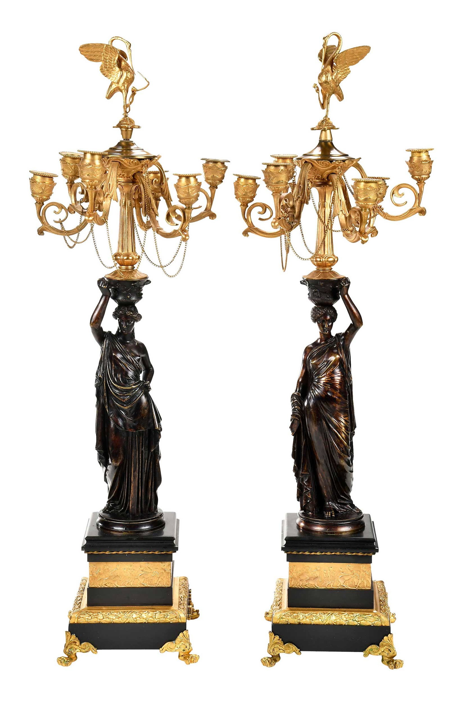 Pair Neoclassical Gilt and Patinated Bronze Figural Six Light Candelabra: Continental, 19th century, each with patinated bronze Classical figure on tiered base, surmounted by gilt bronze column support issuing six scrolled and foliate arms with candle cups and decorative li