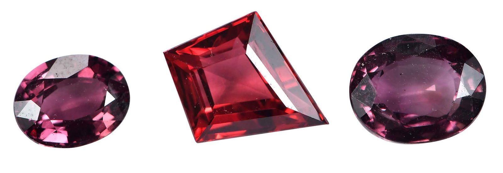 Three Loose Brilliant Cut Rubies, Fancy Shape - One with GIA: one kite step cut Tanzanian ruby, 1.65ct., GIA report number 30930801; two oval brilliant cut Tanzanian rubies, 1.45ct.; 0.78ct. Provenance: Private Collection, Hendersonville, North Carolina Note: Br
