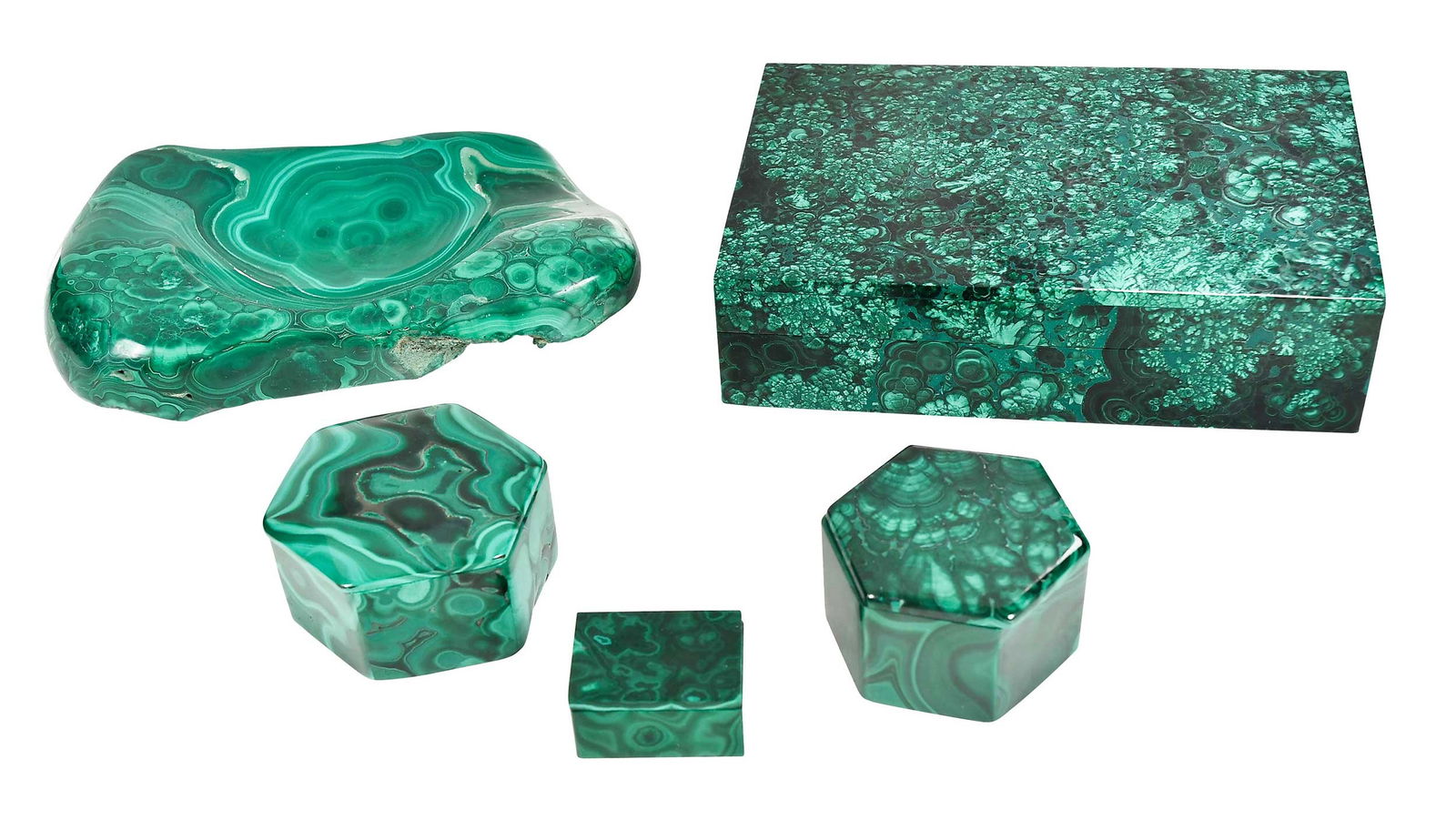 Carved Malachite Collection: five objects, four carved boxes, and one vessel, the largest box 1-1/2 x 6 in., vessel 1-1/4 x 6 in. Provenance: The Life Collection of Sara Graham Peacock