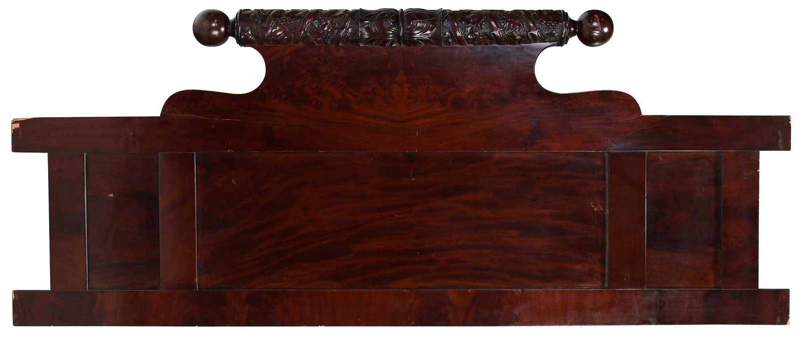 Mahogany Carved Headboard: 19th century, three panels with heavily figured veneer supporting a carved floral top rail, 76 x 31 x 3-1/2 in. Provenance: Property from the Collection of Dee and Tommy Hilfiger