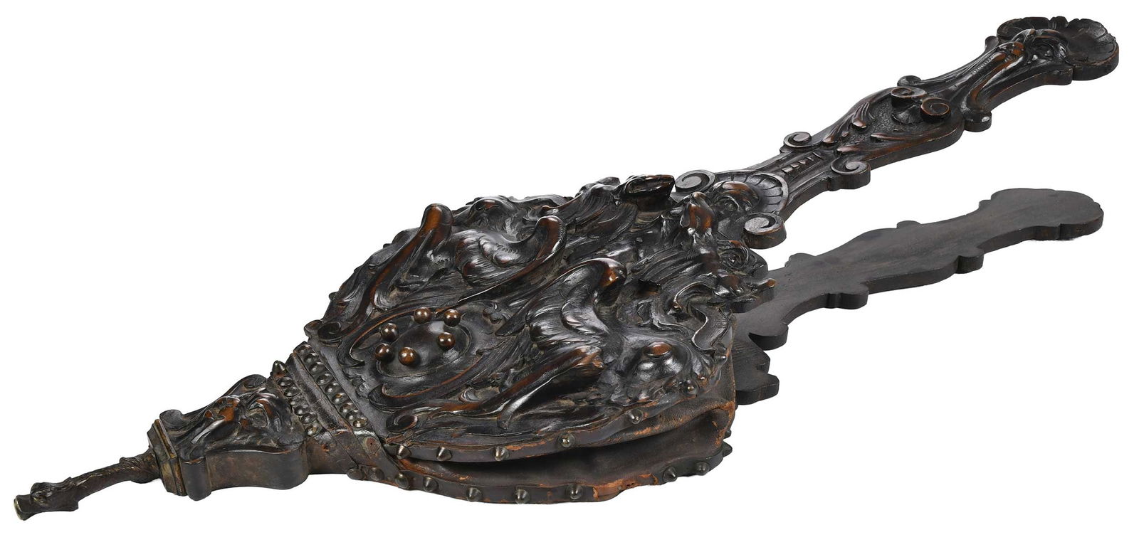 Continental Carved Wood and Leather Bellows: 19th/early 20th century, dark wood panels carved with Gothic motifs, leather sides with brass tacking, 31 x 12 x 2 in. Provenance: Private Collection, Bristol, Tennessee