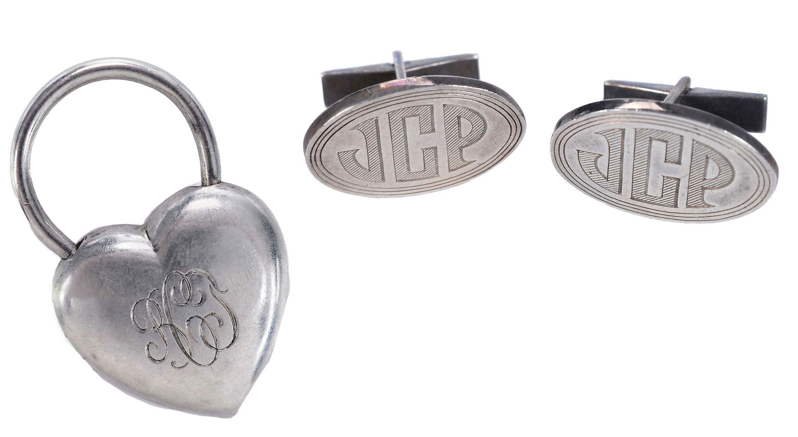 Tiffany & Co. Sterling Keychain and Cufflinks with Bags: heart keychain monogrammed, engraved "10-23-66", stamped "TIFFANY & CO, STERLING", 1-3/4 x 1-1/8 in., 15.4 g; oval monogrammed cufflinks "JCP", stamped "STERLING, TIFFANY & CO", 1 x 3/4 in., 19.4 g; e