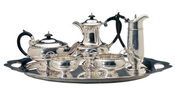 English Silver Tea Service, Silver-: Plated Tray tea service with wooden handles and finials, bead-and-dash borders, marks for Walker & Hall (Sheffield, 1955), heraldic devices, milk pitcher with monogram, .925 fine, 59.58 oz.T., 7-3/4 i