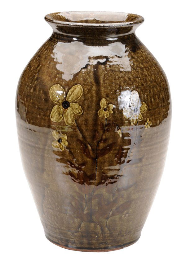 Reggie Meaders Decorated Stoneware Jar: (White County, Georgia, 1919-2009), runny medium olive alkaline glaze, tall flowering plant decoration, base inscribed "Reggie Meaders", 13-3/4 in.; lot accompanied by certificate signed by Cleater Me