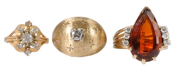 Three Gold Rings: 14 kt. yellow gold "dome" ring, accented with .25 ct. diamond surrounded by six diamonds, estimated combined diamond weight .33 cts., gross weight 9.5 grams, size 5-1/2; one 14 kt. yellow gold set wit