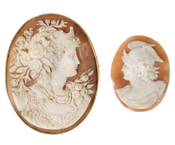 Two Hand-Carved Helmet Shell Cameos: probably Italian, 19th century, brooch with bust of lady with flowers in hair and at shoulders, finely carved in high relief, gold-plated mount, 3-3/4 x 3 in., [frame tarnished and grime on cameo;] un