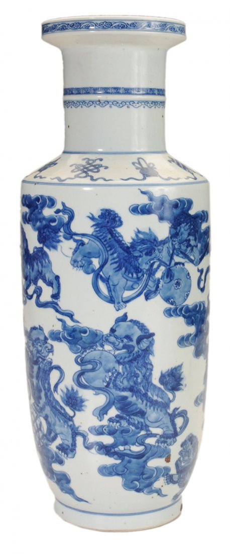 Blue and White Porcelain Vase: Chinese, probably 19th century, with fierce lions at play with ribbons and balls on cloudy background, 18-1/2 in., excellent condition, light surface wear and glaze flaws as made Provenance: From a Ch