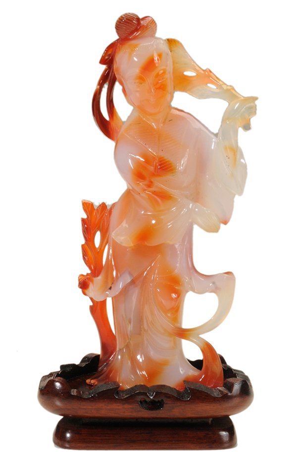 Carved Chalcedony Figure of Standing: Quanyin Chinese, 20th century, 6-1/2 x 3 in., fitted teakwood stand [en suite,] in cloth and silk-lined fitted case, minor stone imperfections on reverse