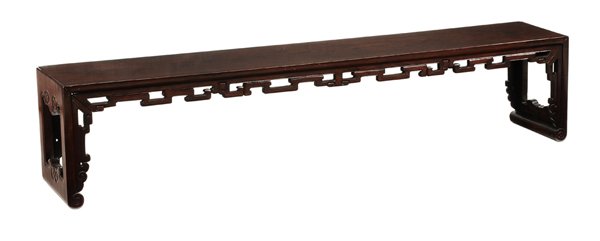 Antique Chinese Carved Hardwood Altar: Table long low form with pierced skirts and scrolled feet, heavy dense figured hardwood throughout, 16 x 78 x 12 in., shrinkage and separations at some joints especially at corners, scattered surface 
